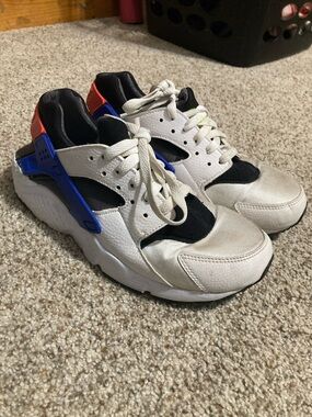 Kids White and Black Nike Sneakers with Blue and Red Accents
